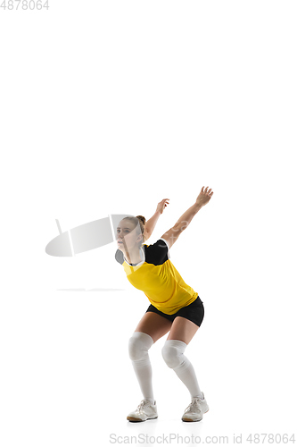 Image of Young female volleyball player isolated on white studio background. Woman in sport\'s equipment training and practicing.