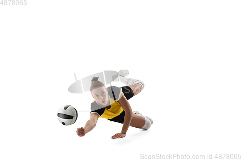 Image of Young female volleyball player isolated on white studio background. Woman in sport\'s equipment training and practicing.