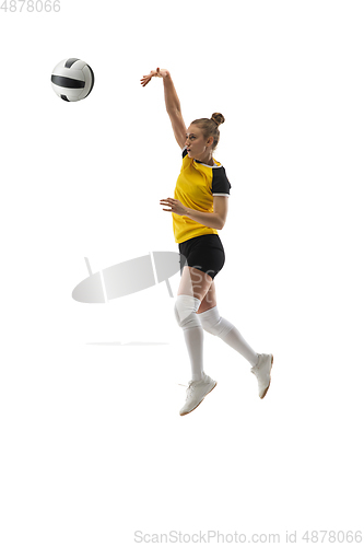 Image of Young female volleyball player isolated on white studio background. Woman in sport\'s equipment training and practicing.