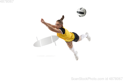 Image of Young female volleyball player isolated on white studio background. Woman in sport\'s equipment training and practicing.