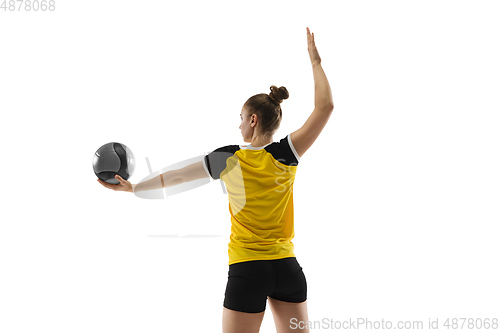 Image of Young female volleyball player isolated on white studio background. Woman in sport\'s equipment training and practicing.