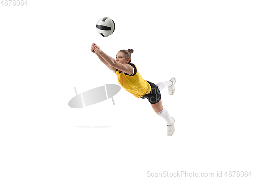 Image of Young female volleyball player isolated on white studio background. Woman in sport\'s equipment training and practicing.