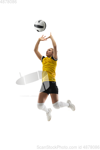 Image of Young female volleyball player isolated on white studio background. Woman in sport\'s equipment training and practicing.