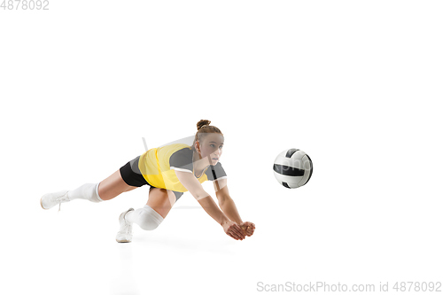 Image of Young female volleyball player isolated on white studio background. Woman in sport\'s equipment training and practicing.