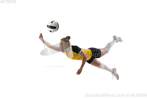 Image of Young female volleyball player isolated on white studio background. Woman in sport\'s equipment training and practicing.