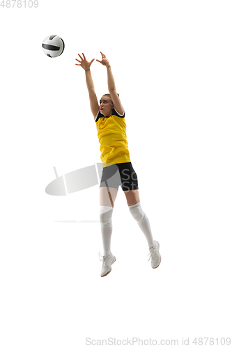 Image of Young female volleyball player isolated on white studio background. Woman in sport\'s equipment training and practicing.