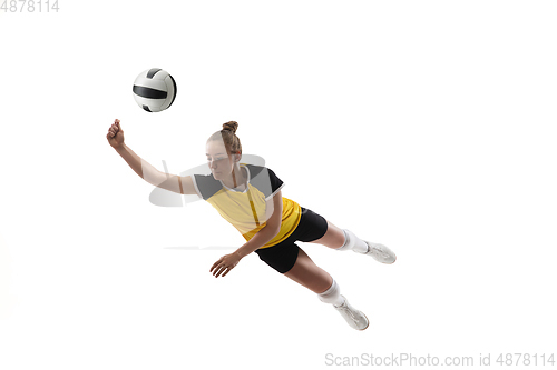 Image of Young female volleyball player isolated on white studio background. Woman in sport\'s equipment training and practicing.