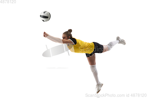 Image of Young female volleyball player isolated on white studio background. Woman in sport\'s equipment training and practicing.