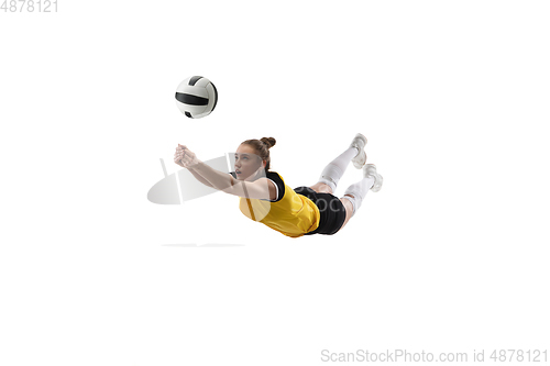 Image of Young female volleyball player isolated on white studio background. Woman in sport\'s equipment training and practicing.