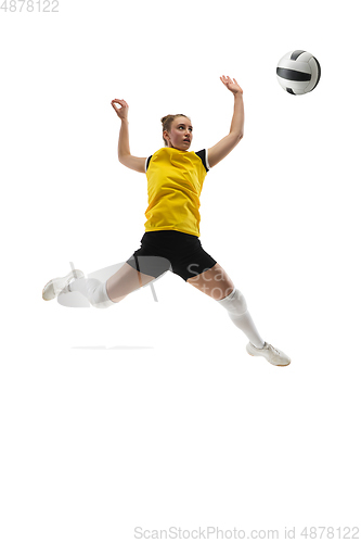 Image of Young female volleyball player isolated on white studio background. Woman in sport\'s equipment training and practicing.