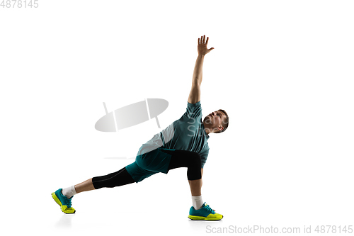 Image of Young caucasian male model in action, motion isolated on white background. Concept of sport, movement, energy and dynamic, healthy lifestyle. Training, practicing.