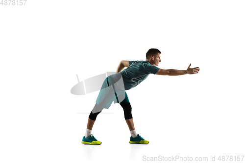 Image of Young caucasian male model in action, motion isolated on white background. Concept of sport, movement, energy and dynamic, healthy lifestyle. Training, practicing.