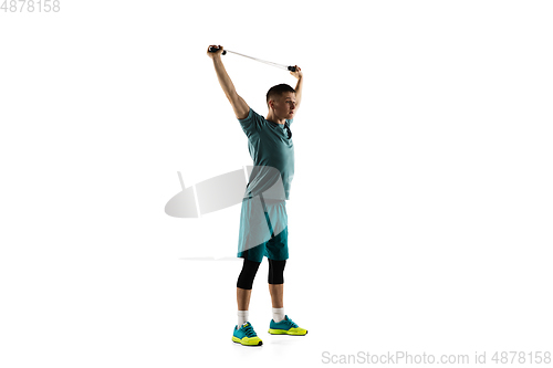 Image of Young caucasian male model in action, motion isolated on white background. Concept of sport, movement, energy and dynamic, healthy lifestyle. Training, practicing.