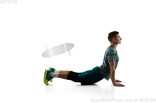 Image of Young caucasian male model in action, motion isolated on white background. Concept of sport, movement, energy and dynamic, healthy lifestyle. Training, practicing.