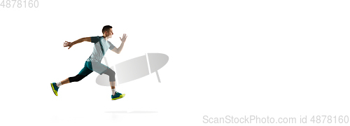 Image of Young caucasian male model in action, motion isolated on white background. Concept of sport, movement, energy and dynamic, healthy lifestyle. Training, practicing.