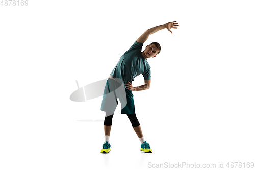 Image of Young caucasian male model in action, motion isolated on white background. Concept of sport, movement, energy and dynamic, healthy lifestyle. Training, practicing.