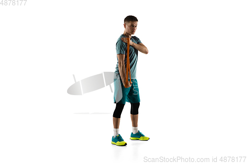 Image of Young caucasian male model in action, motion isolated on white background. Concept of sport, movement, energy and dynamic, healthy lifestyle. Training, practicing.