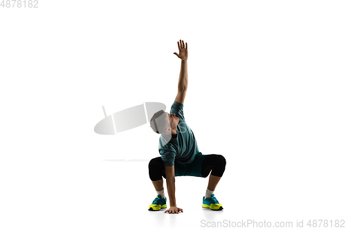 Image of Young caucasian male model in action, motion isolated on white background. Concept of sport, movement, energy and dynamic, healthy lifestyle. Training, practicing.