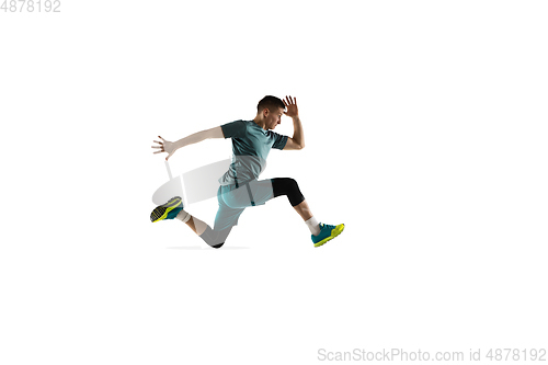 Image of Young caucasian male model in action, motion isolated on white background. Concept of sport, movement, energy and dynamic, healthy lifestyle. Training, practicing.