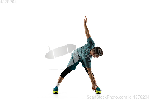 Image of Young caucasian male model in action, motion isolated on white background. Concept of sport, movement, energy and dynamic, healthy lifestyle. Training, practicing.