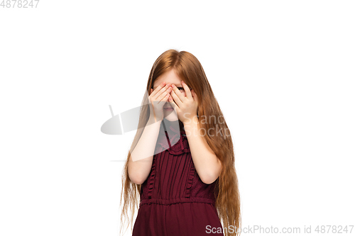 Image of Happy caucasian little girl isolated on white studio background. Looks happy, cheerful, sincere. Copyspace. Childhood, education, emotions concept