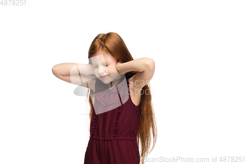 Image of Happy caucasian little girl isolated on white studio background. Looks happy, cheerful, sincere. Copyspace. Childhood, education, emotions concept