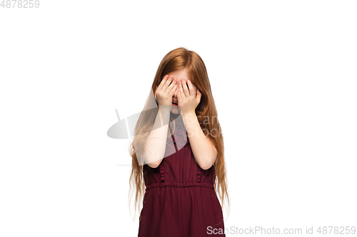 Image of Happy caucasian little girl isolated on white studio background. Looks happy, cheerful, sincere. Copyspace. Childhood, education, emotions concept