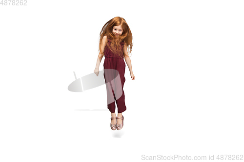 Image of Happy caucasian little girl isolated on white studio background. Looks happy, cheerful, sincere. Copyspace. Childhood, education, emotions concept