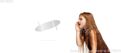 Image of Happy caucasian little girl isolated on white studio background. Looks happy, cheerful, sincere. Copyspace. Childhood, education, emotions concept