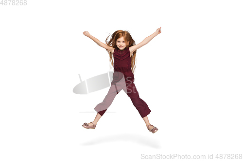 Image of Happy caucasian little girl isolated on white studio background. Looks happy, cheerful, sincere. Copyspace. Childhood, education, emotions concept