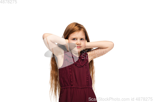 Image of Happy caucasian little girl isolated on white studio background. Looks happy, cheerful, sincere. Copyspace. Childhood, education, emotions concept