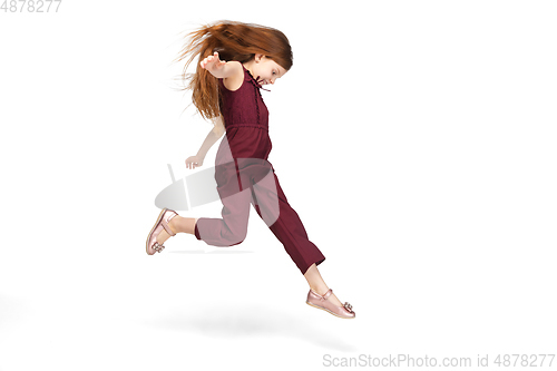 Image of Happy caucasian little girl isolated on white studio background. Looks happy, cheerful, sincere. Copyspace. Childhood, education, emotions concept