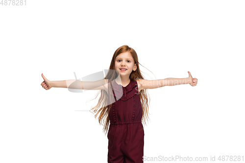 Image of Happy caucasian little girl isolated on white studio background. Looks happy, cheerful, sincere. Copyspace. Childhood, education, emotions concept