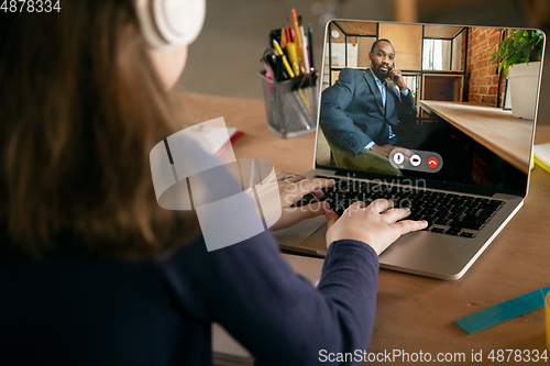 Image of Little girl studying by group video call, use video conference with teacher, listening to online course