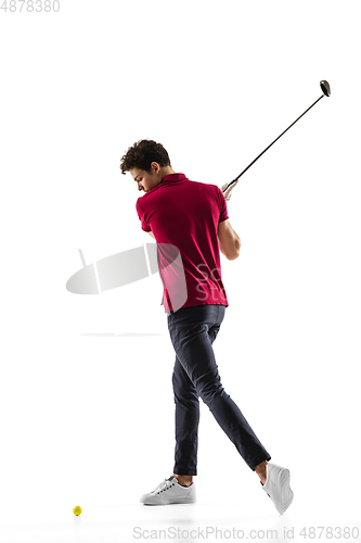 Image of Golf player in a red shirt taking a swing isolated on white studio background