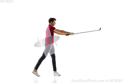 Image of Golf player in a red shirt taking a swing isolated on white studio background