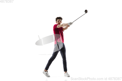 Image of Golf player in a red shirt taking a swing isolated on white studio background