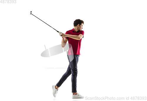 Image of Golf player in a red shirt taking a swing isolated on white studio background