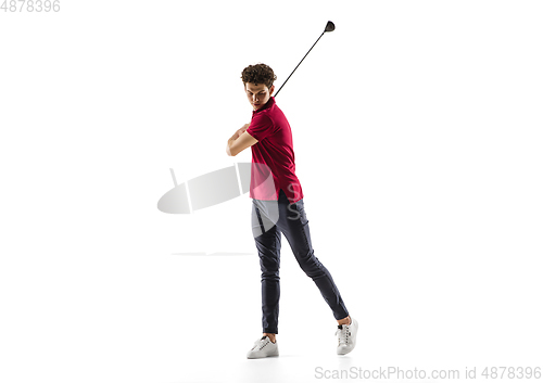Image of Golf player in a red shirt taking a swing isolated on white studio background