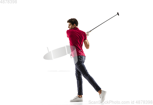 Image of Golf player in a red shirt taking a swing isolated on white studio background