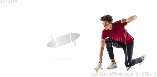 Image of Golf player in a red shirt training, practicing isolated on white studio background