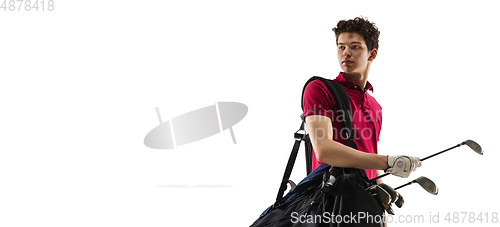 Image of Golf player in a red shirt training, practicing isolated on white studio background