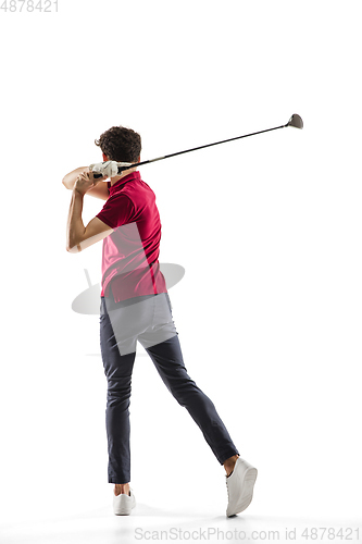 Image of Golf player in a red shirt taking a swing isolated on white studio background