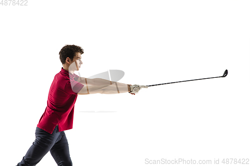 Image of Golf player in a red shirt taking a swing isolated on white studio background