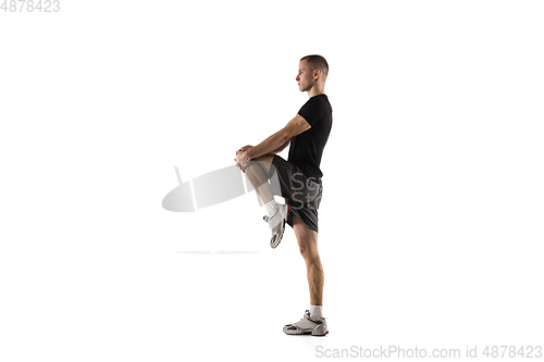 Image of Young caucasian male model in action, motion isolated on white background. Concept of sport, movement, energy and dynamic, healthy lifestyle. Training, practicing.