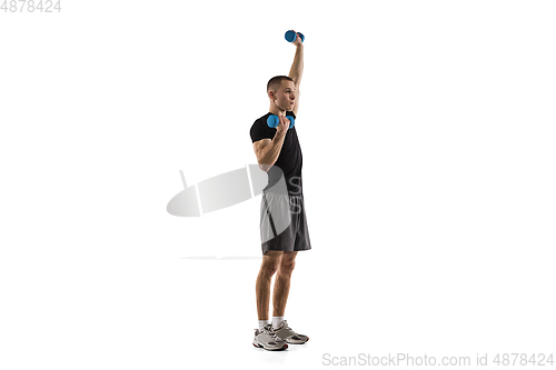 Image of Young caucasian male model in action, motion isolated on white background. Concept of sport, movement, energy and dynamic, healthy lifestyle. Training, practicing.