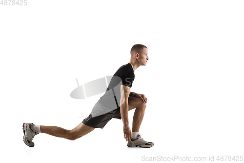 Image of Young caucasian male model in action, motion isolated on white background. Concept of sport, movement, energy and dynamic, healthy lifestyle. Training, practicing.