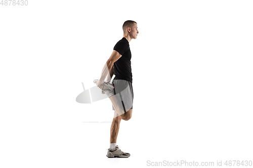 Image of Young caucasian male model in action, motion isolated on white background. Concept of sport, movement, energy and dynamic, healthy lifestyle. Training, practicing.