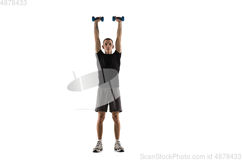 Image of Young caucasian male model in action, motion isolated on white background. Concept of sport, movement, energy and dynamic, healthy lifestyle. Training, practicing.