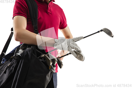 Image of Golf player in a red shirt training, practicing isolated on white studio background